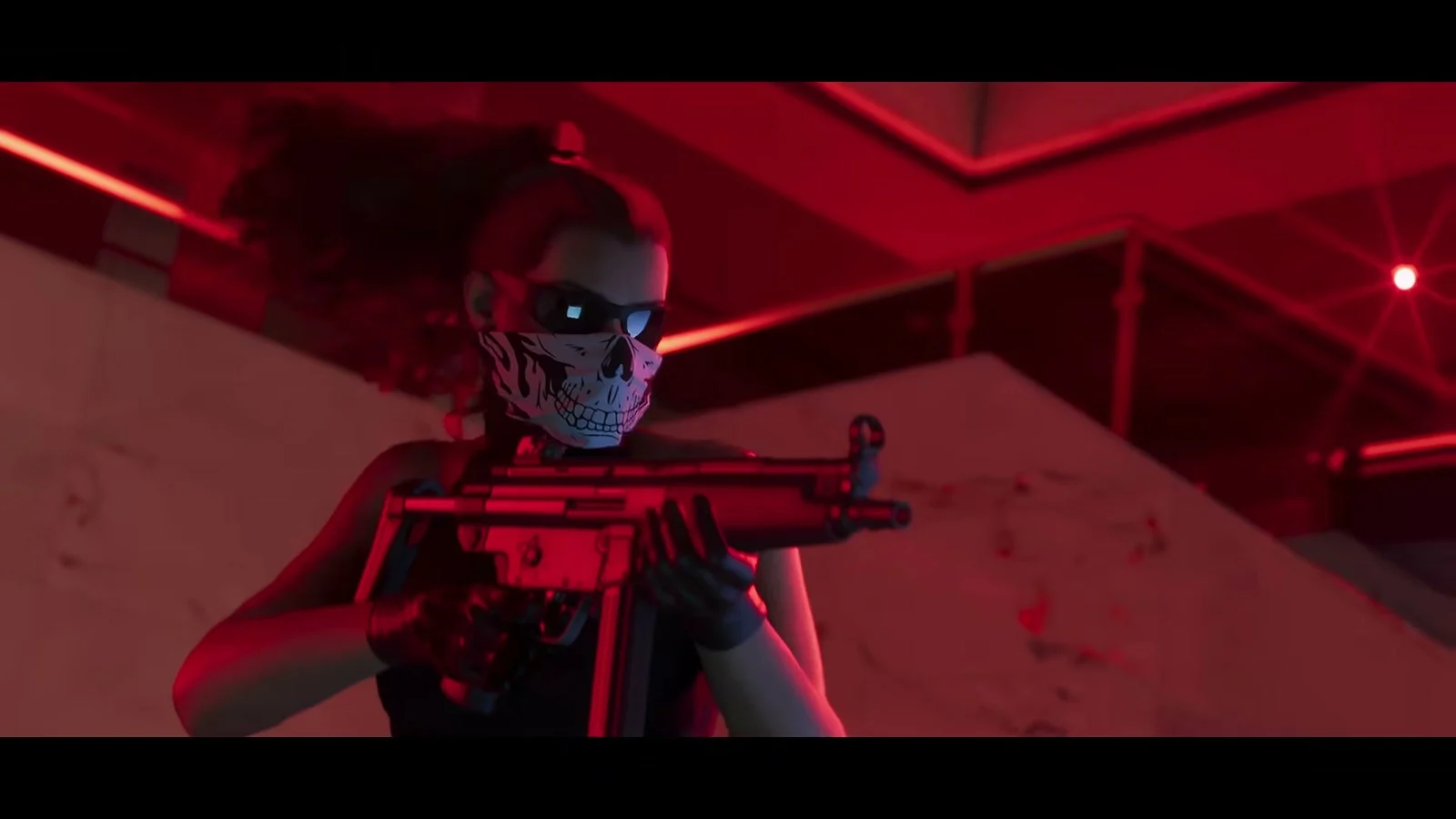Lucia in a skull bandana and sunglasses raises a submachine gun under red light, official GTA VI footage