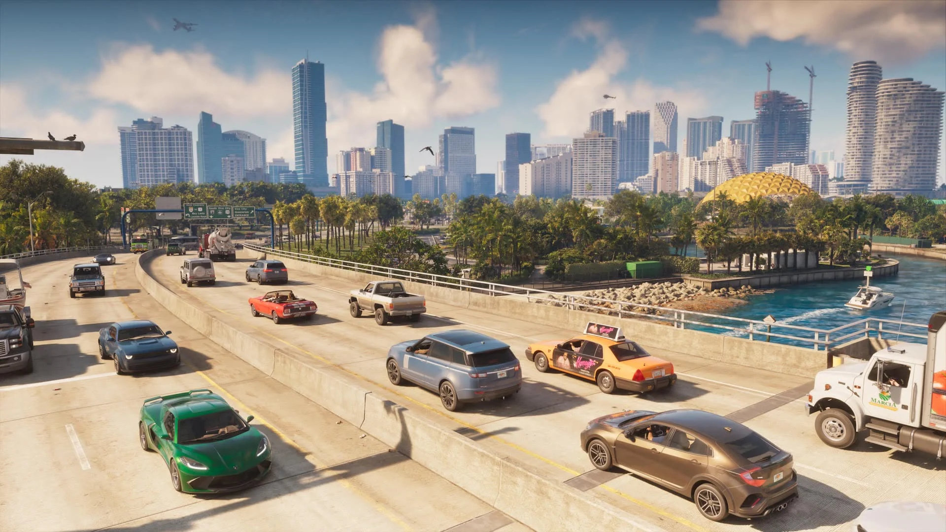 Traffic on a highway into downtown Vice City, its towers along the water, official GTA VI screenshot